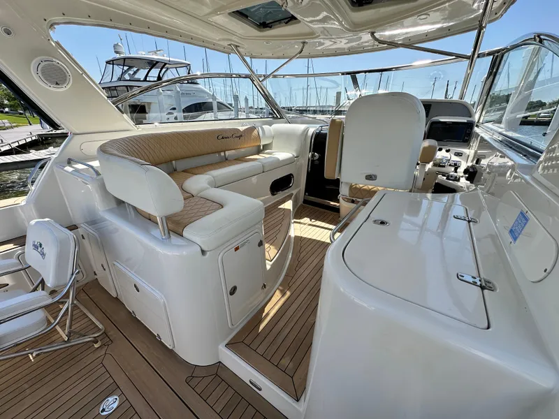 Slide: The Image of 2007 Chris-Craft Roamer 40 yacht interior with elegant seating and polished wood flooring. - 15