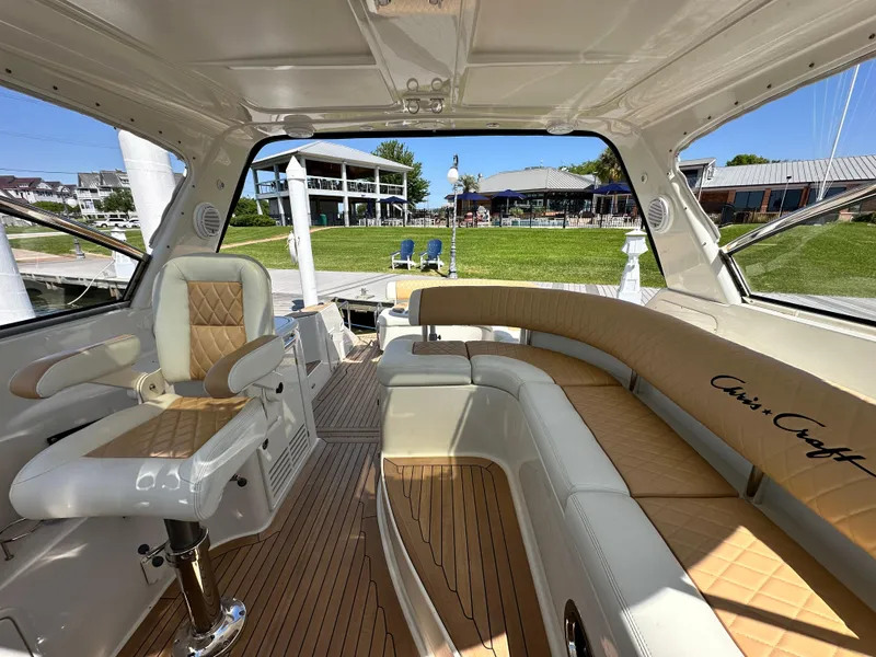 Slide: The Image of Luxurious 2007 Chris-Craft Roamer 40 yacht interior with elegant seating and wood flooring. - 16