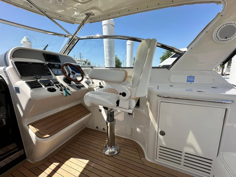 Slide: The Image of 2007 Chris-Craft Roamer 40 helm with modern controls and luxurious seating. - 18