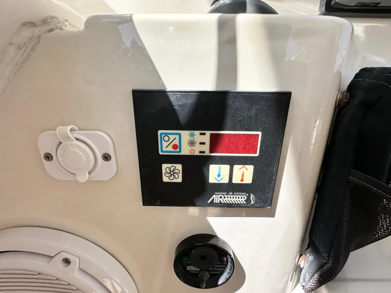 Slide: The Image of Control panel on a 2007 Chris-Craft Roamer 40 boat, featuring various function icons. - 22