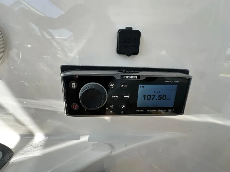 Slide: The Image of Fusion marine radio on 2007 Chris-Craft Roamer 40, displaying FM 107.50 MHz. - 23