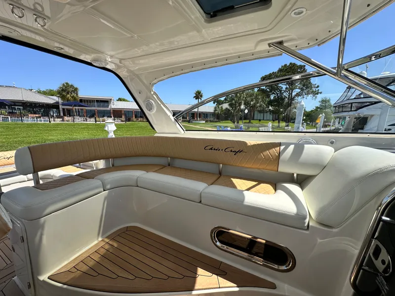 Slide: The Image of Luxurious 2007 Chris-Craft Roamer 40 yacht interior with elegant seating and wood accents. - 28