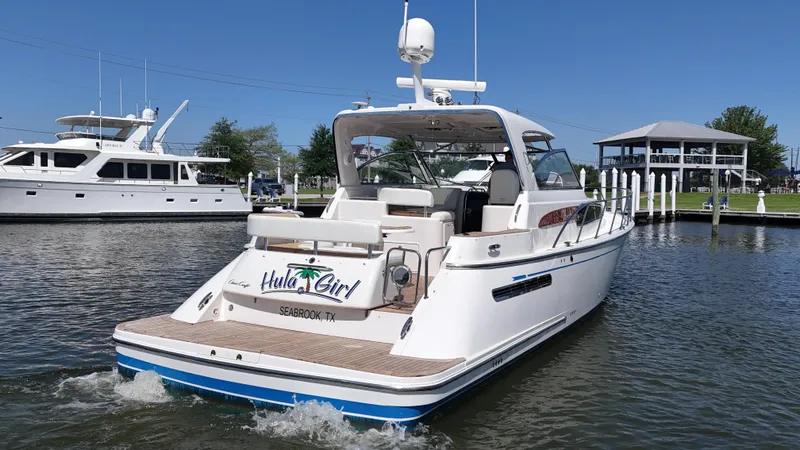 Slide: The Image of 2007 Chris-Craft Roamer 40 yacht on water, rear view, sunny day, marina background. - 3