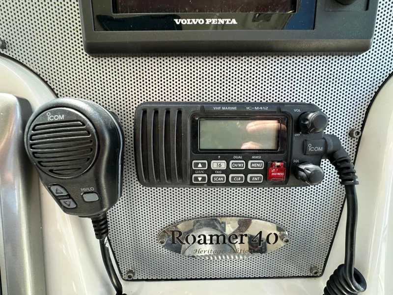 Slide: The Image of 2007 Chris-Craft Roamer 40 dashboard with Icom marine radio and Volvo Penta display. - 33