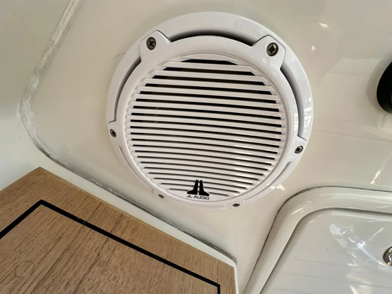 Slide: The Image of White JL Audio speaker on 2007 Chris-Craft Roamer 40 boat interior. - 37