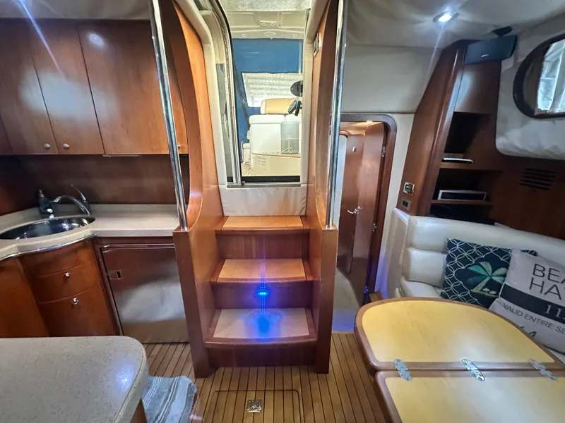 Slide: The Image of Interior of 2007 Chris-Craft Roamer 40 yacht with wooden cabinetry and seating area. - 43