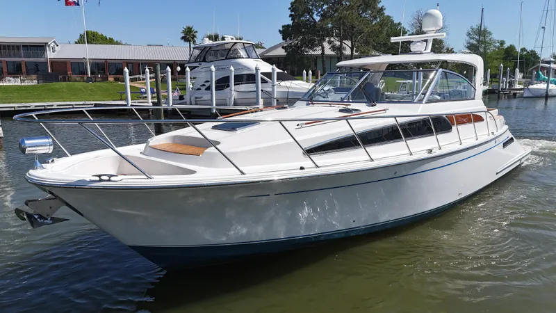 Slide: The Image of 2007 Chris-Craft Roamer 40 yacht docked in a marina, showcasing sleek design and luxury features. - 5