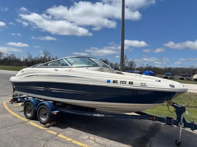 Slide: The Image of 2007 Sea Ray 200 Sundeck boat on trailer under blue sky. - 0