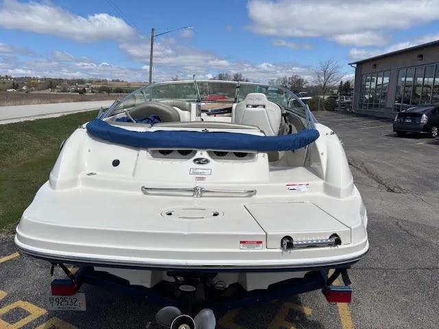 Slide: The Image of 2007 Sea Ray 200 Sundeck boat parked outdoors on a sunny day. - 10