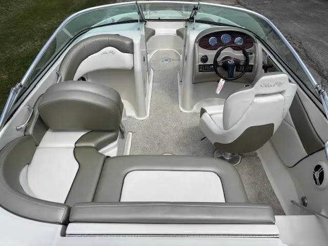 Slide: The Image of 2007 Sea Ray 200 Sundeck interior with seating and dashboard view. - 19