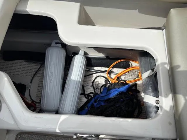 Slide: The Image of Storage compartment in a 2007 Sea Ray 200 Sundeck with ropes and fenders. - 20