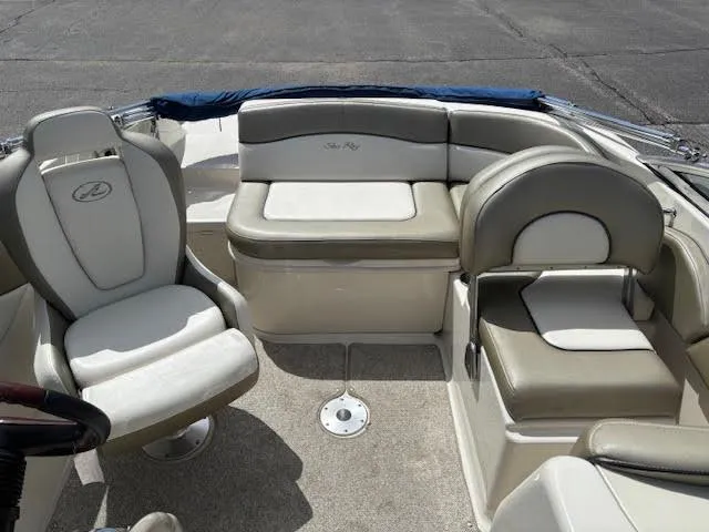 Slide: The Image of 2007 Sea Ray 200 Sundeck interior with beige and white seating arrangement. - 21