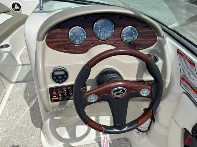 Slide: The Image of Steering wheel and dashboard of 2007 Sea Ray 200 Sundeck boat. - 26