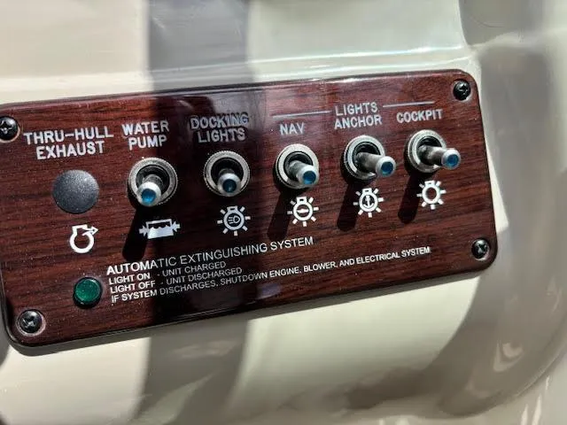 Slide: The Image of Control panel of a 2007 Sea Ray 200 Sundeck boat with various switches. - 30