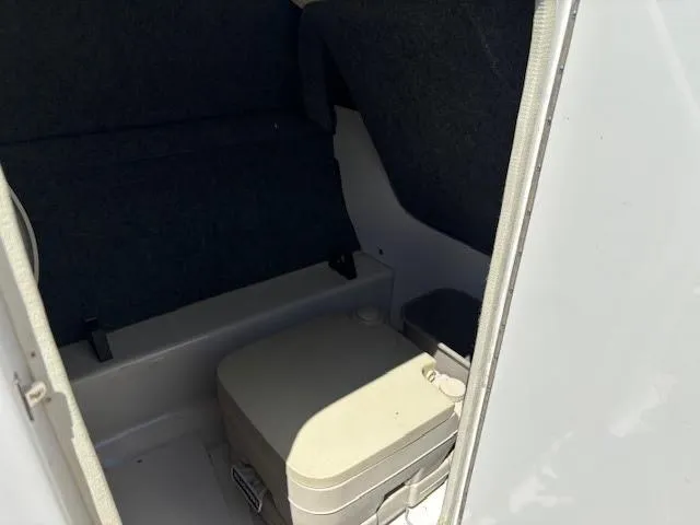 Slide: The Image of Interior of 2007 Sea Ray 200 Sundeck boat with portable toilet. - 32