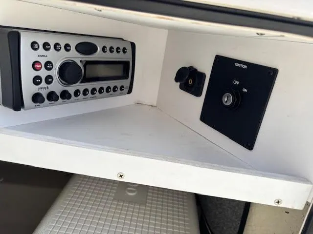 Slide: The Image of Control panel of a 2007 Sea Ray 200 Sundeck boat with radio and ignition switch. - 34