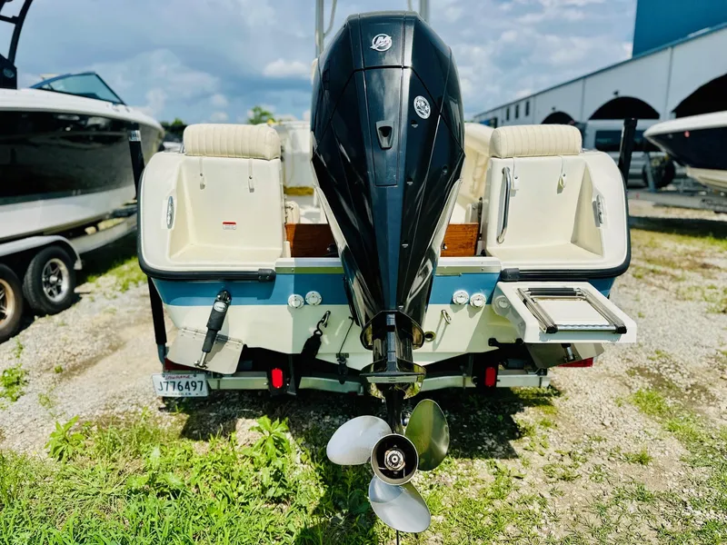 Slide: The Image of Rear view of a 2014 Mako 204 CC boat with outboard motor. - 3