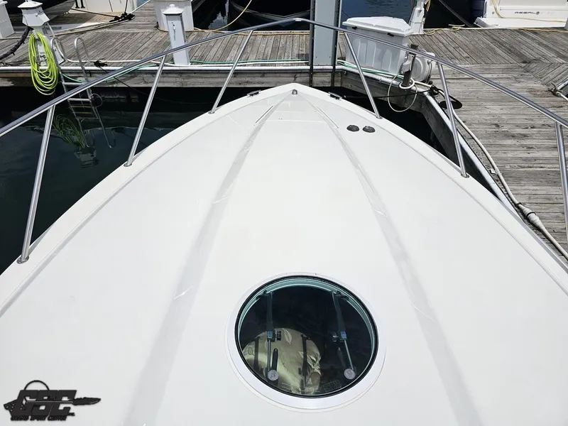 Slide: The Image of 2006 Fountain 48 Express Cruiser bow view at dock. - 20