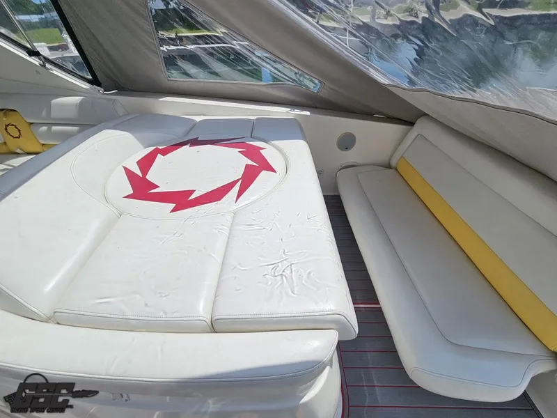 Slide: The Image of 2006 Fountain 48 Express Cruiser interior with white seating and red design. - 32