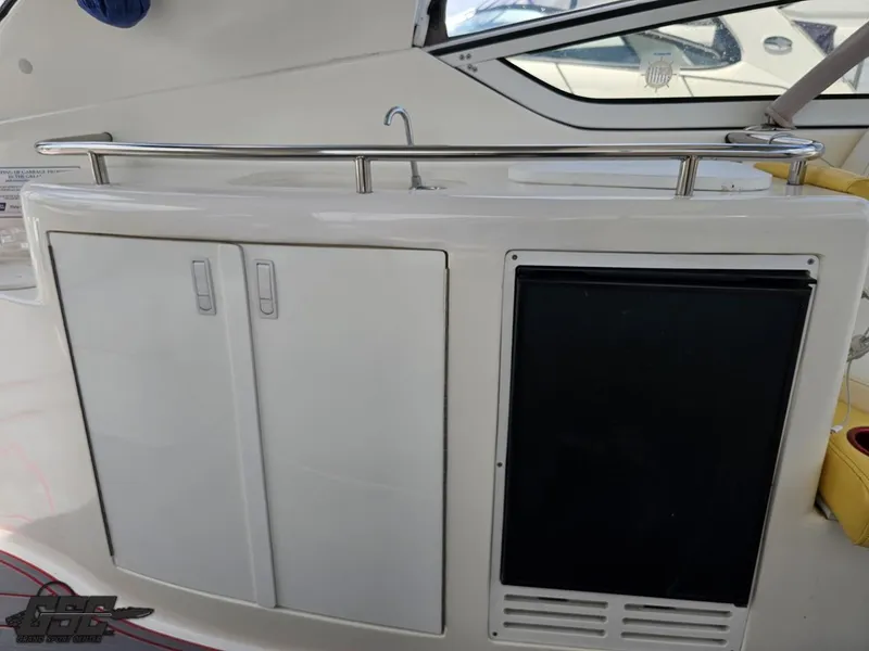 Slide: The Image of 2006 Fountain 48 Express Cruiser interior with cabinets and mini fridge. - 35