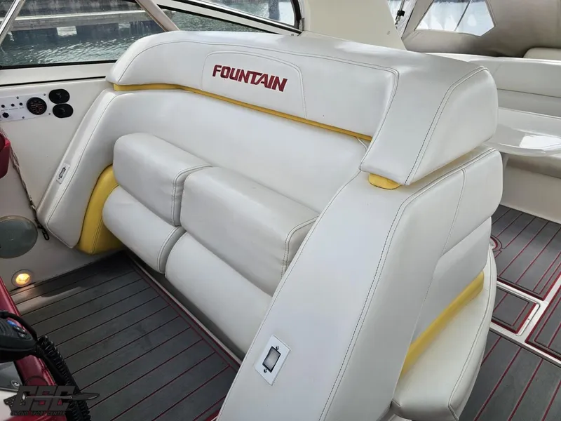 Slide: The Image of 2006 Fountain 48 Express Cruiser interior with white and yellow seating. - 42
