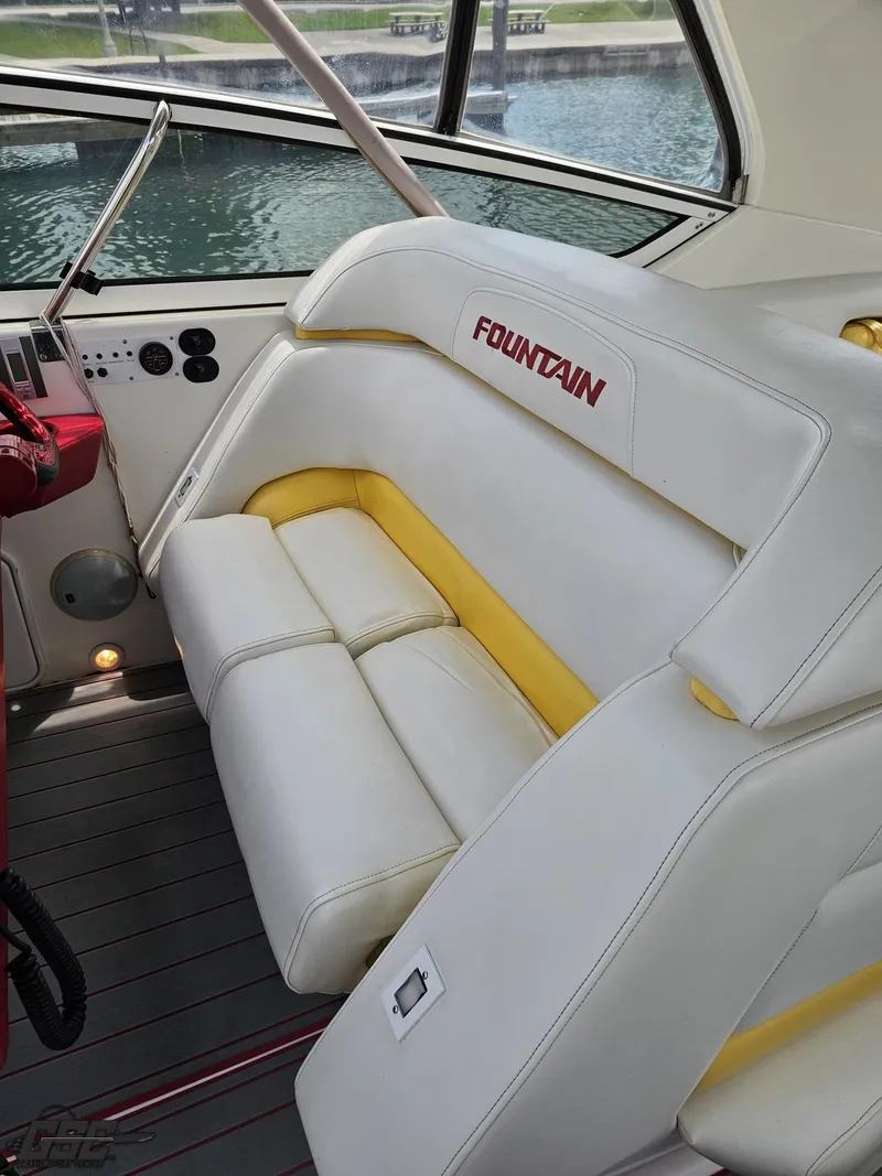 Slide: The Image of Interior of 2006 Fountain 48 Express Cruiser with white and yellow seating. - 43