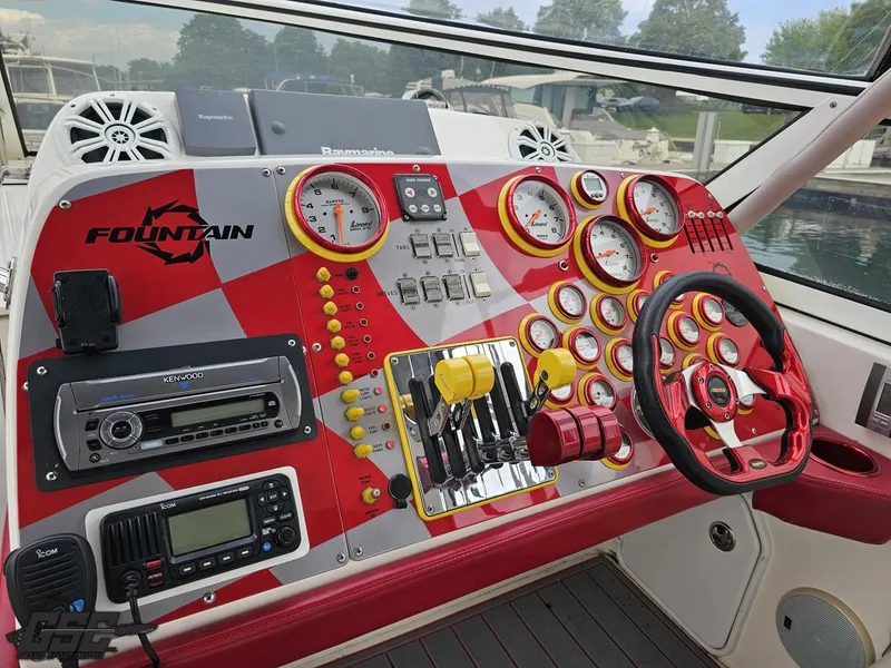 Slide: The Image of Control panel of a 2006 Fountain 48 Express Cruiser with red and white design. - 44