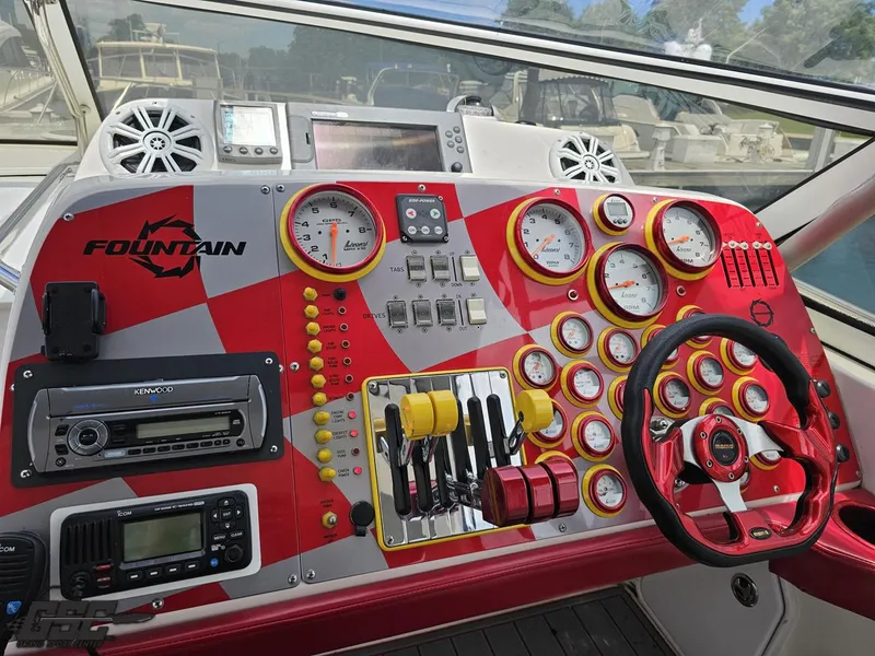 Slide: The Image of 2006 Fountain 48 Express Cruiser dashboard with gauges, controls, and steering wheel. - 45