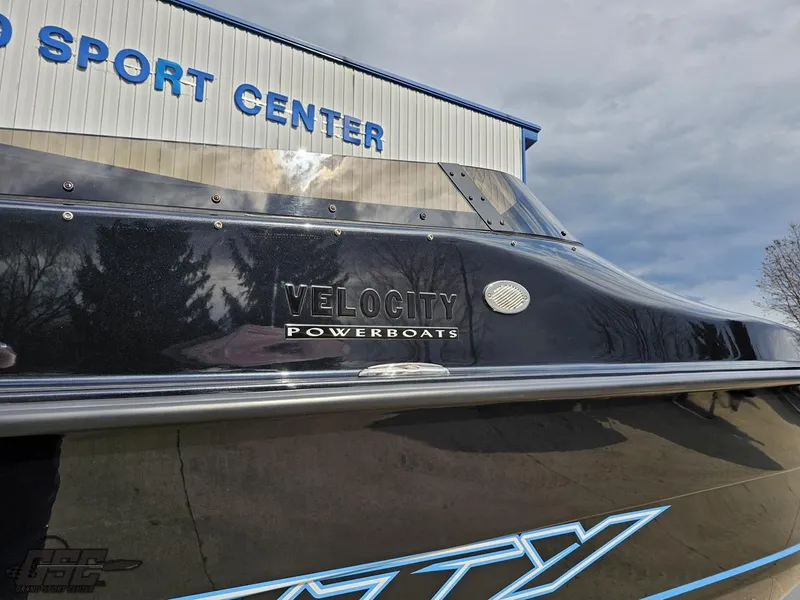 Slide: The Image of 2022 Velocity 290SC Signature Series powerboat at a sport center. - 12