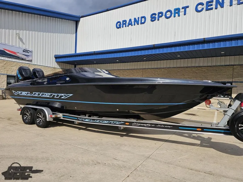 Slide: The Image of 2022 Velocity 290SC Signature Series boat on trailer at Grand Sport Center. - 14