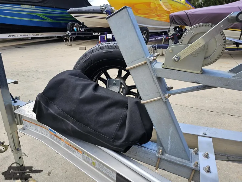 Slide: The Image of Trailer with spare tire and winch for 2022 Velocity 290SC Signature Series boat. - 19