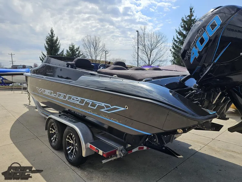 Slide: The Image of 2022 Velocity 290SC Signature Series boat on trailer, featuring sleek design and powerful engine. - 27