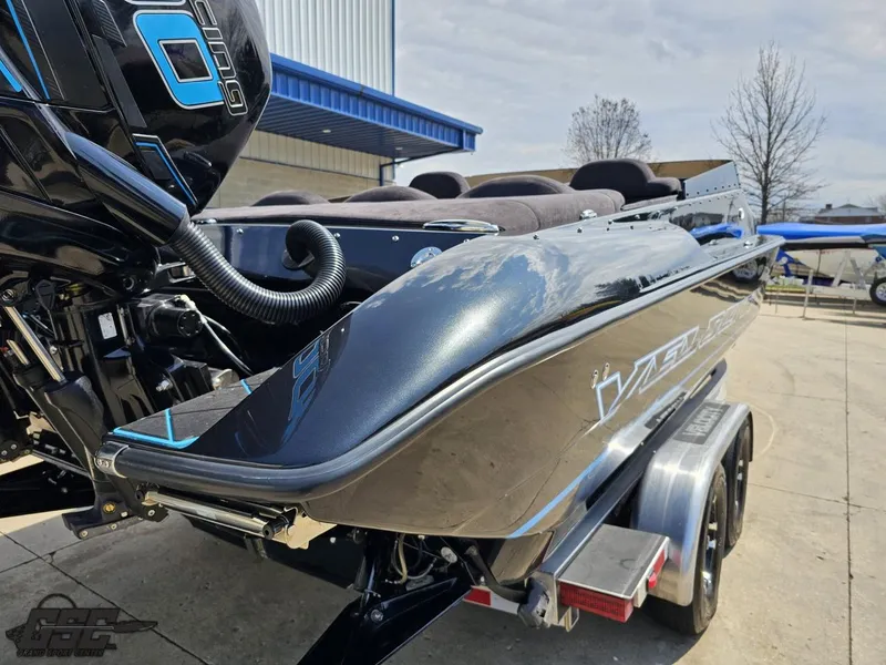 Slide: The Image of 2022 Velocity 290SC Signature Series boat on trailer, showcasing sleek design and powerful engine. - 34