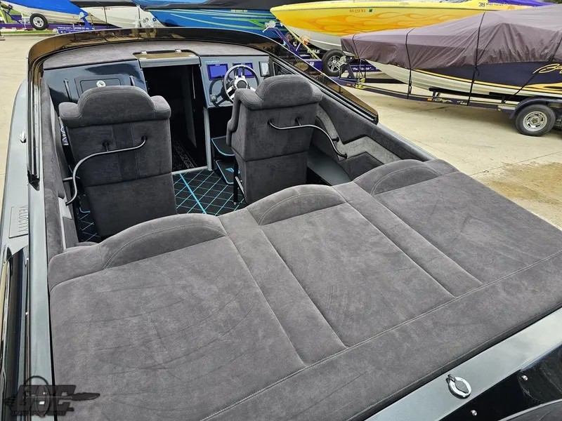 Slide: The Image of 2022 Velocity 290SC Signature Series boat interior with plush seating and modern dashboard. - 37