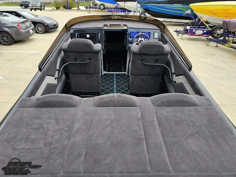 Slide: The Image of 2022 Velocity 290SC Signature Series boat interior with plush seating and modern dashboard. - 39