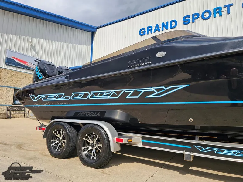 Slide: The Image of 2022 Velocity 290SC Signature Series boat on trailer at Grand Sport facility. - 4
