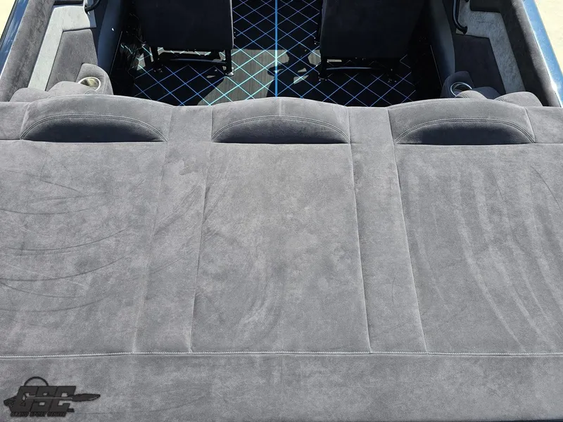 Slide: The Image of 2022 Velocity 290SC Signature Series boat interior with plush gray seating and stylish design. - 40