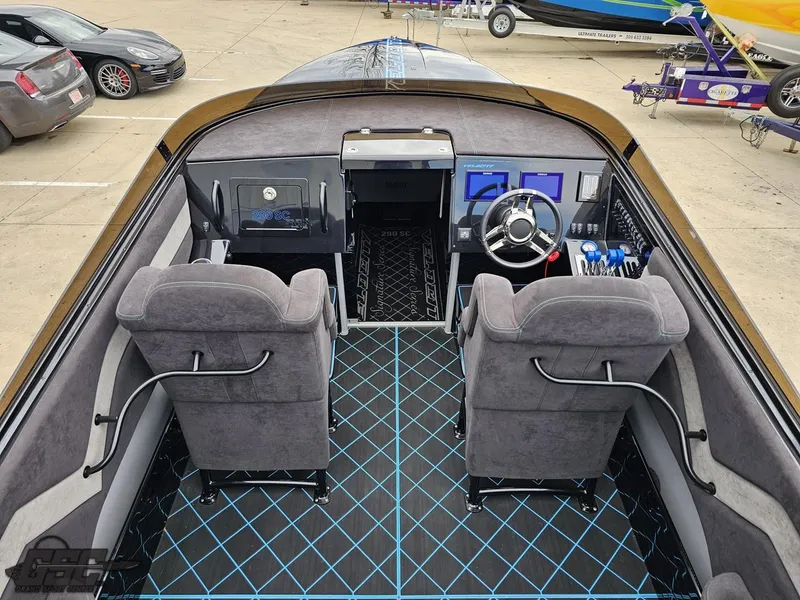 Slide: The Image of 2022 Velocity 290SC Signature Series boat interior with modern dashboard and plush seating. - 41