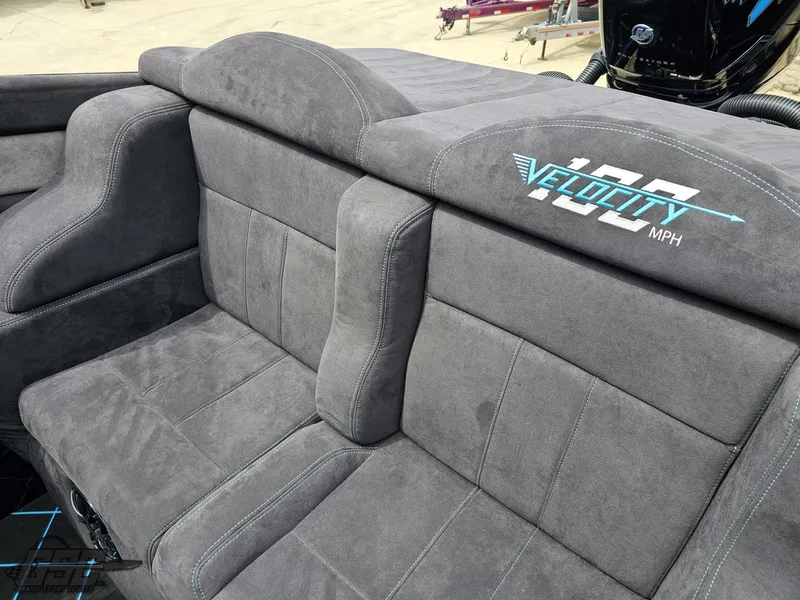 Slide: The Image of Gray interior seating of 2022 Velocity 290SC Signature Series boat with logo. - 45