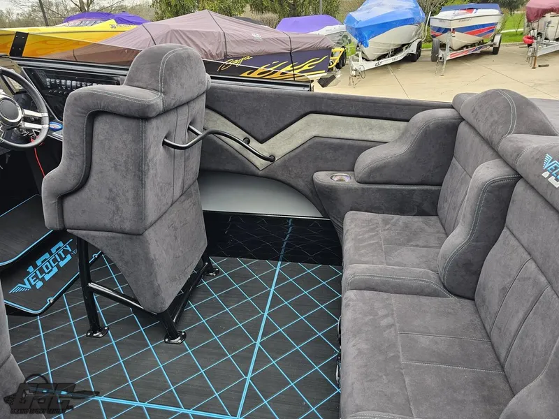 Slide: The Image of Interior of 2022 Velocity 290SC Signature Series boat with gray seating and modern design. - 48