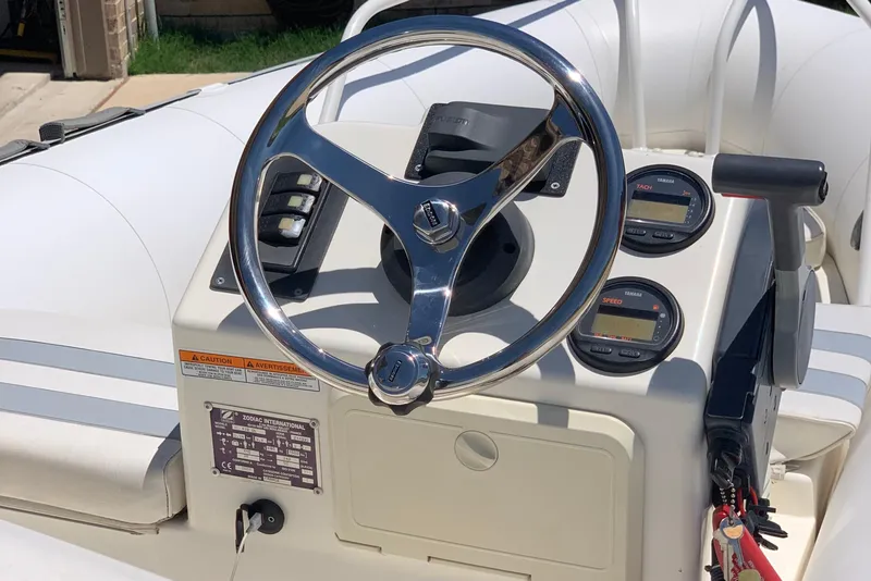Slide: The Image of 2002 Zodiac Yachtline 420 Deluxe steering console with gauges and controls. - 5