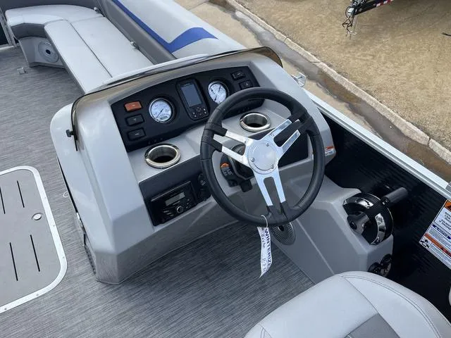 Slide: The Image of 2020 Bennington 22 SLX boat dashboard with steering wheel and gauges. - 16