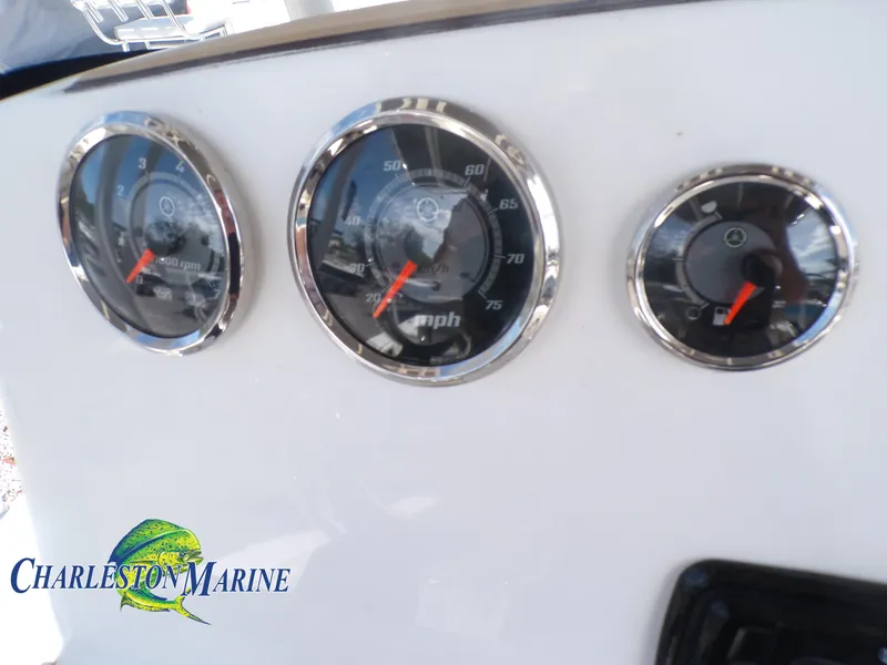 Slide: The Image of Dashboard gauges of 2023 NauticStar 227 XTS boat, featuring speedometer and tachometer. - 10