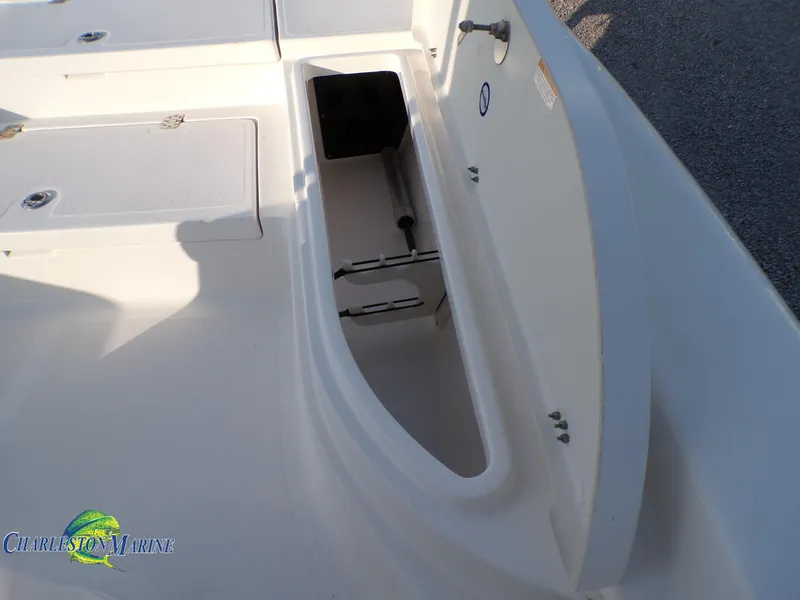 Slide: The Image of 2023 NauticStar 227 XTS boat deck with storage compartment open. - 18