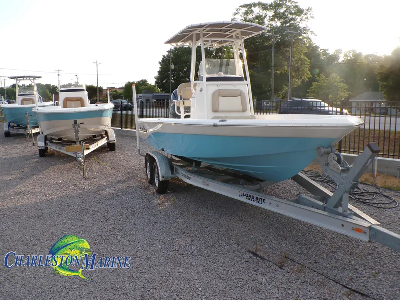 Slide: The Image of 2023 NauticStar 227 XTS boat on trailer at Charleston Marine dealership. - 2