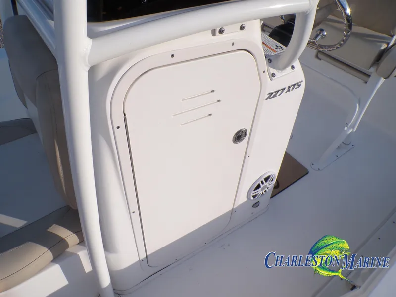 Slide: The Image of 2023 NauticStar 227 XTS boat console with Charleston Marine logo. - 22