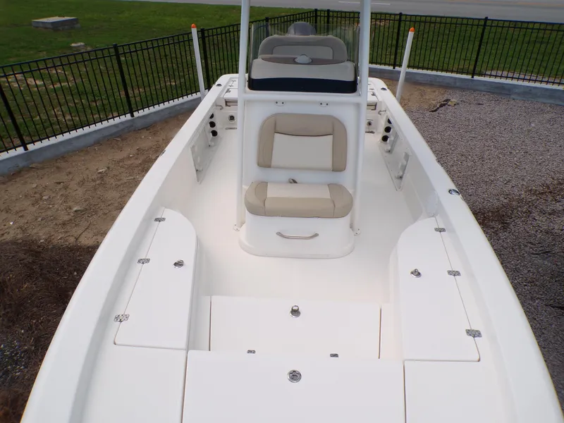 Slide: The Image of 2023 NauticStar 227 XTS boat interior with seating and storage compartments. - 7