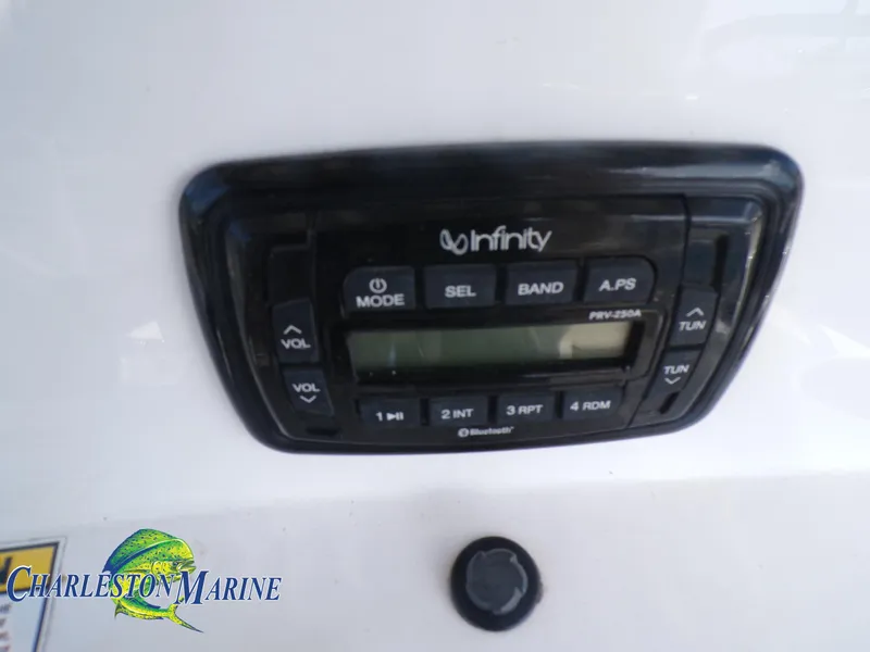 Slide: The Image of Infinity stereo system on 2023 NauticStar 227 XTS boat dashboard. - 9