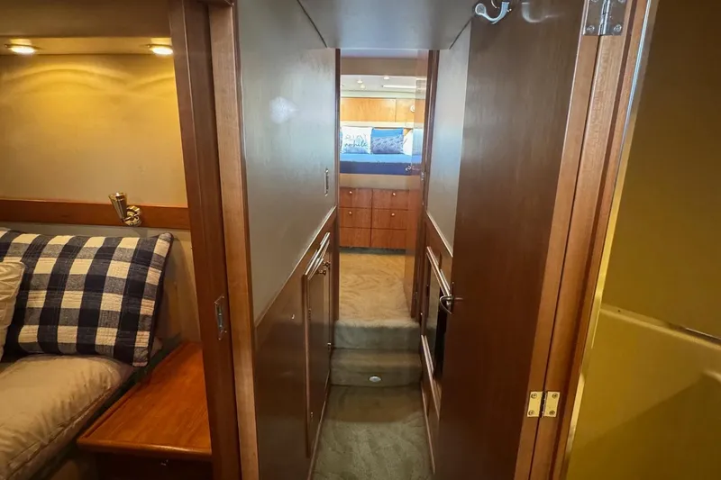 Slide: The Image of Interior view of 2004 Meridian 490 Pilothouse yacht, featuring cozy cabin and hallway. - 13