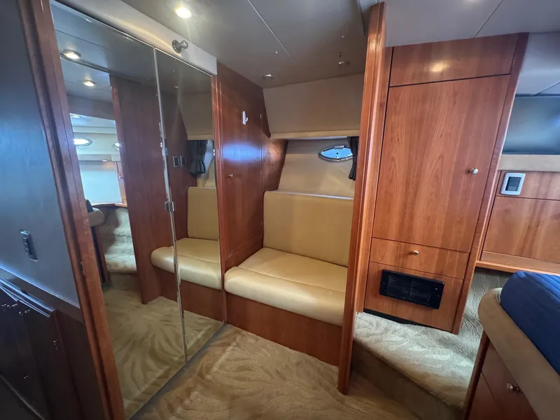 Slide: The Image of Interior of 2004 Meridian 490 Pilothouse with wood paneling and beige seating. - 16